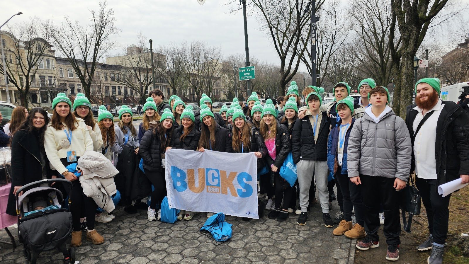 CTeen Bucks teens holding their Bucks banner together for a group photo