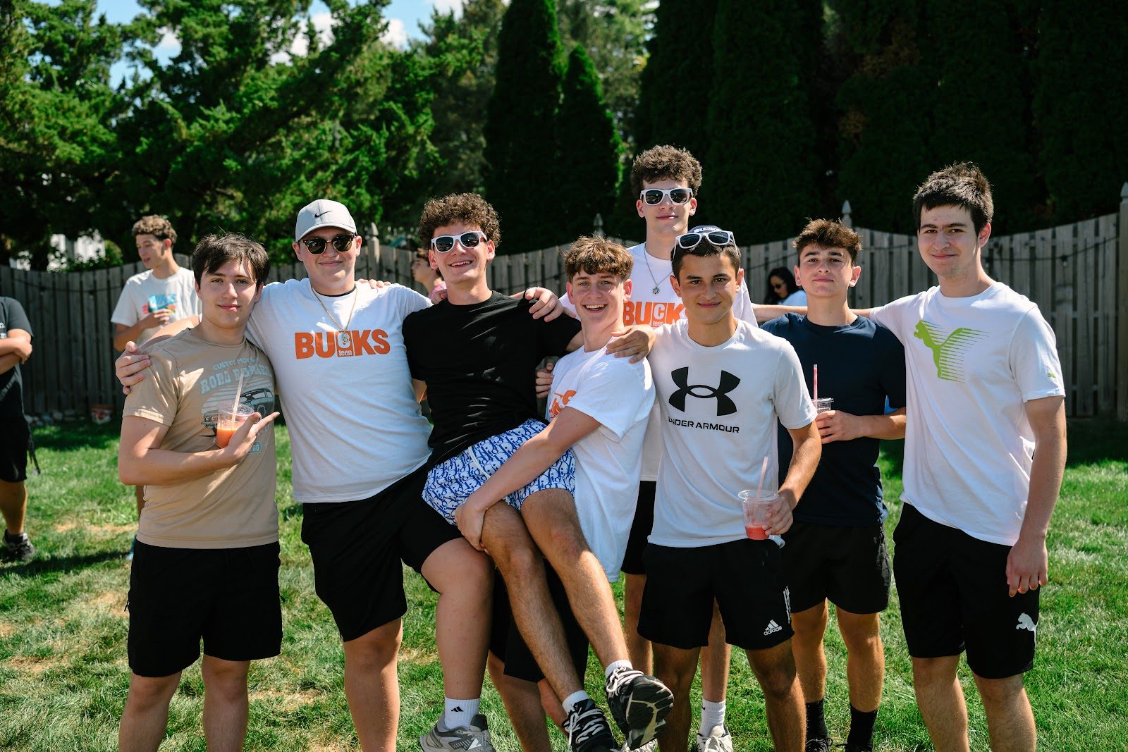 A group of CTeen Bucks boys posing together at the kickoff BBQ